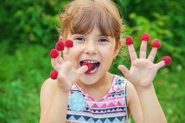 kid with raspberries on fingers, Port Alberni farm markets