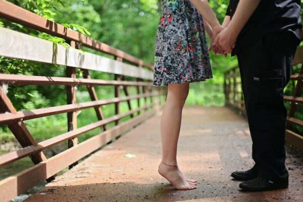 Couple Holding Hands on a bridge. Spend a beautiful Valentine's Day in Alberni Valley nature!