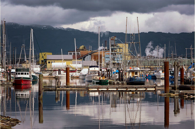 Winter view of the waterfront marina in Port Alberni with boats moored under cloudy skies