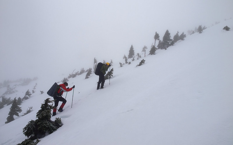 Winter ascent on Mount Arrowsmith showing steep alpine terrain and limited visibility