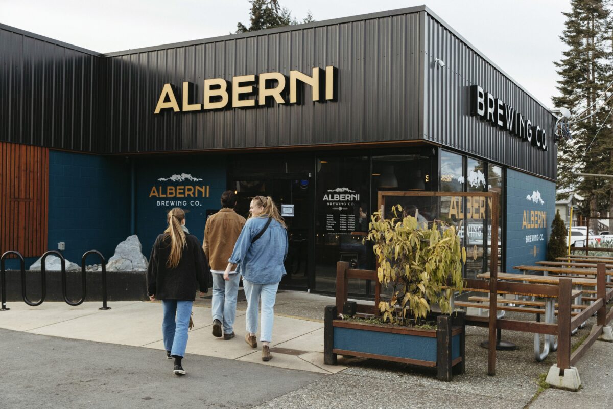 Exterior of a brewery with a step-free entrance and a manual door.