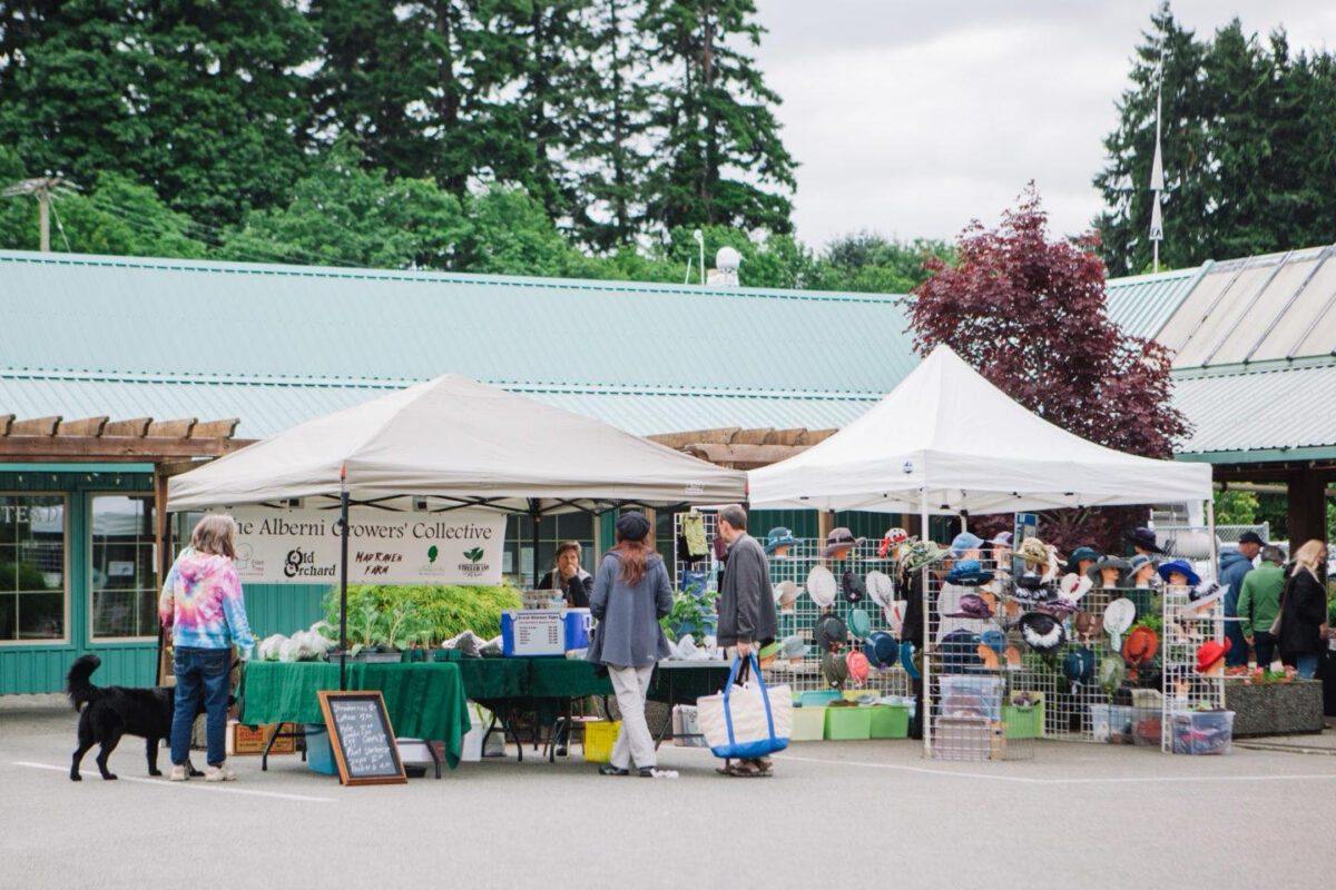 Shoppers browsing local produce and handmade goods at a Port Alberni farmers’ market